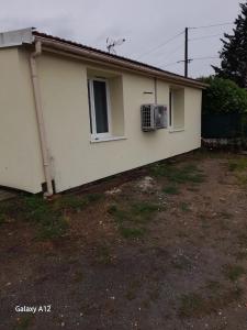 a house with a air conditioner on the side of it at Maison agréable à Bellerive-sur-Allier 70 m² in Charmeil
