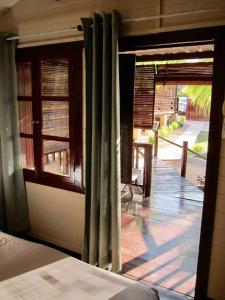 an open door to a porch with a window at Charming apartment in Albion with shared pool, 20.3 m² in Albion +73 photos