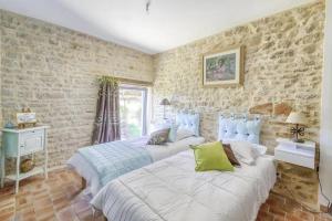 Voodi või voodid majutusasutuse Maison confortable avec jardin à Talon - 90 m² toas