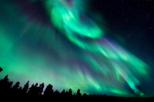 an image of the northern lights in the sky at Santa's Luxury Suite 3BDR, Sauna & Wifi in Rovaniemi