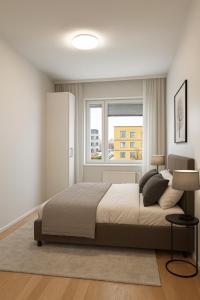 a bedroom with a large bed and a window at Santa's Luxury Suite 3BDR, Sauna & Wifi in Rovaniemi