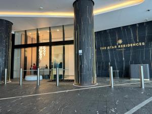 a shopping mall with a sign on the side of a building at Casino & Luxury Sky High Oceanview 2BR 2BA Parking in Gold Coast +25 photos