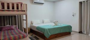 Postel nebo postele na pokoji v ubytování Teplong - The Paix, Kaziranga