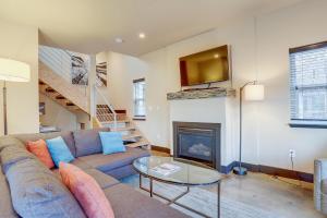 a living room with a couch and a fireplace at Urban Roundabout in Bend
