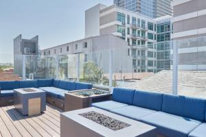 a rooftop patio with blue couches on a building at The Davis Downtown San Diego in San Diego