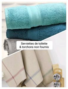 a stack of towels and towels at Les Voiles Blanches in Le Crotoy +16 photos