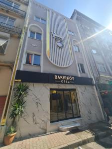 a building with a bakery sign on the side of it at Bakırköy Otel in Istanbul
