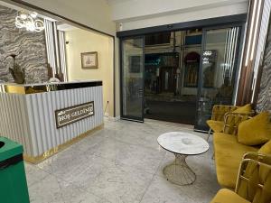 a store front with a coffee table and chairs at Bakırköy Otel in Istanbul