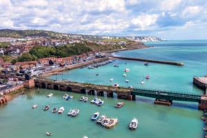 an aerial view of a harbor with boats in the water at The Grand Burstin Hotel in Folkestone