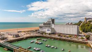 an aerial view of a harbor with boats in the water at The Grand Burstin Hotel in Folkestone