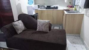 a couch with two pillows on it in a kitchen at Mtwapa june apartment 3 in Mtwapa