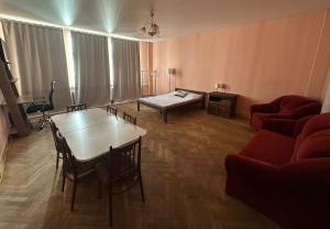 a living room with a table and a couch at EBU 28 in Rīga