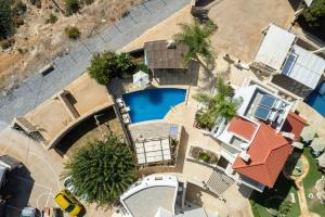 an overhead view of a swimming pool next to a house at Sunshine Villa with Private Pool by Estia in Hersonissos
