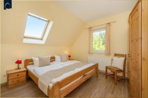 Ένα ή περισσότερα κρεβάτια σε δωμάτιο στο Villen am See - 4-Raum Häuser DHH See- Idyll 2