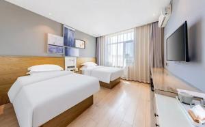 Μια τηλεόραση ή/και κέντρο ψυχαγωγίας στο Jin Yi Chain Hotel Gulou General's Mansion Subway Station Branch