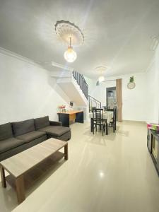 a living room with a couch and a table at Private Villa Near Nusa Dua Beach Bali in Nusa Dua