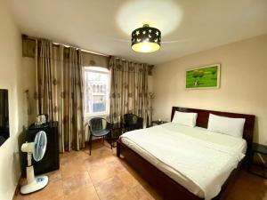 Ένα ή περισσότερα κρεβάτια σε δωμάτιο στο Hotel Gia Huyên Quận 10