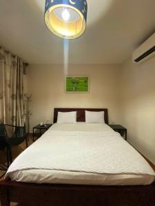 Ένα ή περισσότερα κρεβάτια σε δωμάτιο στο Hotel Gia Huyên Quận 10