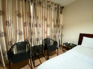 Ένα ή περισσότερα κρεβάτια σε δωμάτιο στο Hotel Gia Huyên Quận 10