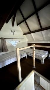 a small room with a bed and a window at Chalet Le Capéna Lac de Payolle in Campan