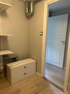 a room with a white door and a box at Apartment in beautiful area Edsviken, close to Stockholm in Sollentuna