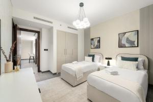 Ένα ή περισσότερα κρεβάτια σε δωμάτιο στο FIRST CLASS 3BR Stylish Luxury Escape +27 φωτογραφίες