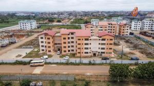 an aerial view of a building in a city at Ranscilla Homes & Apartments in Tema