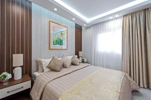 a bedroom with a large bed and a window at The sunset resorts - منتجع ساحل الغروب in Jeddah +61 photos