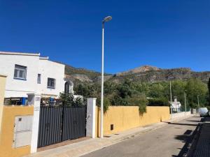 a street with a fence and a street light at Casa Villami, GROUND FLOOR APARTMENT in Marchuquera