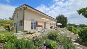 a house with a garden in front of it at Panoramic Villa In The Lucca Hills in Capannori