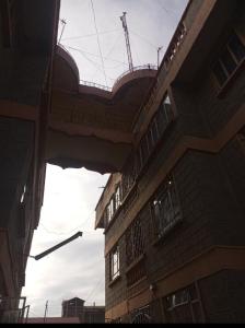 a building with a balcony on the side of it at Swahiba's 254 in Keruguya