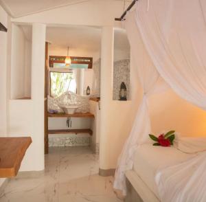 Ένα ή περισσότερα κρεβάτια σε δωμάτιο στο Casa Marrocos Arraial d'Ajuda +24 φωτογραφίες