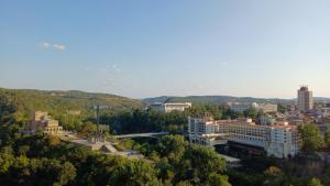 a view of a city with a bridge and buildings at Meridian Hotel Bolyarski in Veliko Tŭrnovo +85 photos