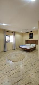 a large room with a bed and a rug at Morena villa in Kendwa