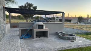 a outdoor oven is set up in a yard at Casa nueva en La Estancia de Cafayate in Cafayate