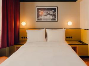 Ένα ή περισσότερα κρεβάτια σε δωμάτιο στο The Companion Vienna l Opening Spring 2026 +16 φωτογραφίες