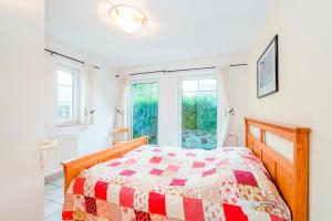 Ένα ή περισσότερα κρεβάτια σε δωμάτιο στο Haus Boddenkieker 6 Fewo Nr 1