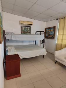 a hospital room with two bunk beds in it at Casa Punta Chame in Punta Chame