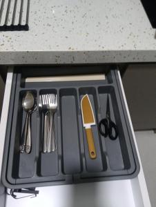 a kitchen tray with utensils on a counter at 168 Mall Selayang Batu Caves Totoro Theme Residence in Batu Caves
