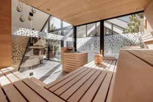 a room with a wooden bench in a house at MYALPS Tirol inklusive Sky- Wellness in Oetz