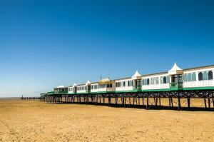 a train on a pier on the beach at The Lytham Retreat - New! Spacious & Luxurious in Lytham St Annes