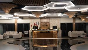 a lobby of a hotel with a reception desk at Hotel Mundo Maya Tulum Aeropuerto in Tulum