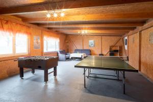 a large room with a ping pong table in it at Norderhof Hansen - Ferienhaus in Nordstrand