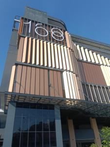a building with a clock on the side of it at 168 Mall Selayang Batu Caves Totoro Theme Residence in Batu Caves