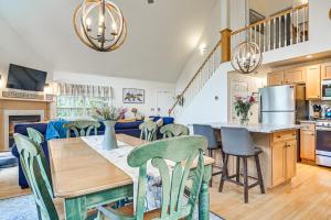 a kitchen and living room with a table and chairs at Pet-Friendly Home with Hot Tub Near Cranmore! in Conway