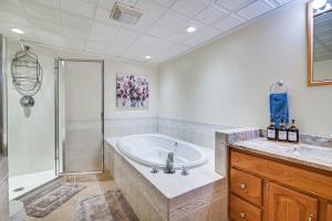 a large bathroom with a tub and a shower at Pet-Friendly Home with Hot Tub Near Cranmore! in Conway +37 photos