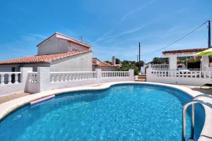 a swimming pool in front of a house at Tossal Gros in La Font D´En Carròs