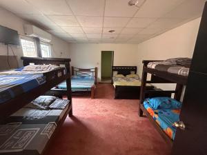 Postel nebo postele na pokoji v ubytování Hostal Mafelo Taganga