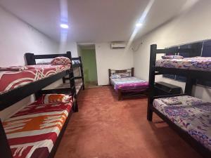 Postel nebo postele na pokoji v ubytování Hostal Mafelo Taganga