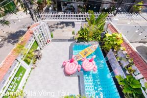 an overhead view of a swimming pool with a surfboard at Sunny Villa 109 Võ Thị Sáu in Vung Tau